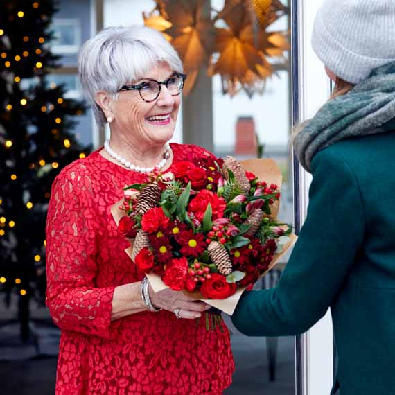 Christmas flowers being gifted